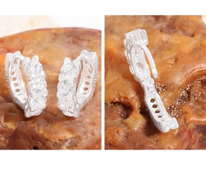 Detail view of S925 sterling silver hoop earrings with clear cubic zirconia stones