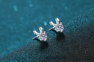 Macro view of S925 sterling silver reindeer horn studs with sparkling round moissanite