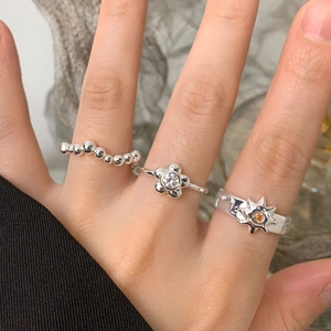 Three-piece S925 sterling silver ring set with floral, beaded and starburst sun designs