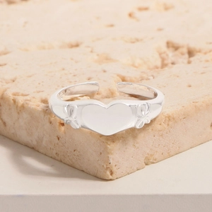 Polished S925 sterling silver open ring with central heart and side bow details on stone