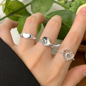 S925 sterling silver heart rings in solid, fluid, and hollow designs on a hand