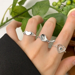 Set of three irregular heart rings in S925 sterling silver worn on a hand