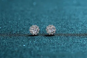 Macro shot of S925 sterling silver flower stud earrings with a large moissanite center stone
