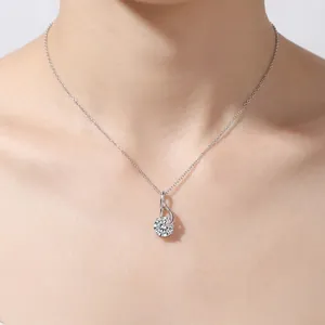 S925 sterling silver necklace with a 2 carat teardrop moissanite pendant on a model