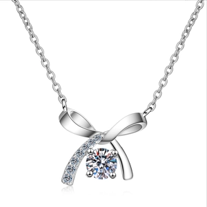 Elegant s925 sterling silver bow necklace with 0.5ct moissanite pendant on white background