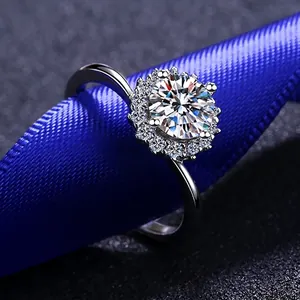 Sunflower style 925 sterling silver ring with brilliant round moissanite on blue silk