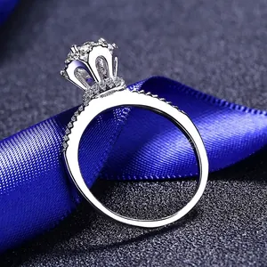 Elegant S925 sterling silver ring with four-prong moissanite and pave diamond band