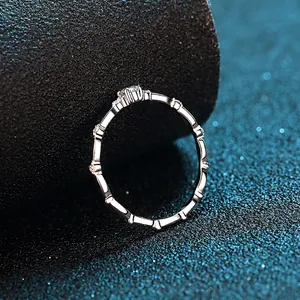 Elegant S925 silver eternity ring with segmented pavé moissanite stones in a minimalist style