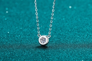 Macro shot of S925 sterling silver necklace with a bezel-set moissanite stone