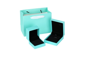 Teal blue jewelry gift set featuring a paper tote bag and two velvet-lined display boxes