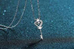 Macro shot of a S925 silver key pendant with heart crown and sparkling moissanite stone