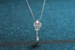 Detail of S925 sterling silver crown heart key necklace with sparkling moissanite stone