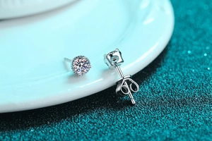 Detailed view of silver S925 stud earrings with sparkling round halo moissanite stones