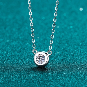 S925 sterling silver bubble necklace with brilliant round cut moissanite pendant on blue background
