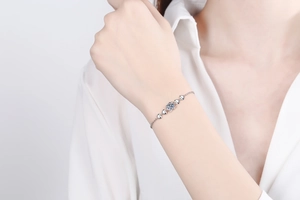 Moissanite S925 silver bracelet featuring heart-shaped links on a model wrist