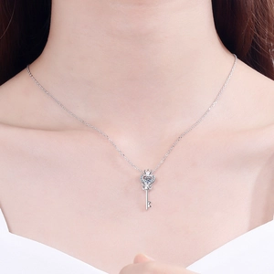Elegant S925 sterling silver heart key necklace featuring a sparkling moissanite stone