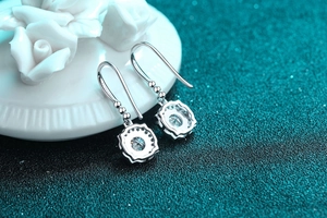 Close-up of S925 sterling silver hook earrings with 1ct moissanite in 18K gold finish