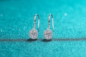 Macro view of S925 silver hook earrings with sparkling round moissanite in a square frame