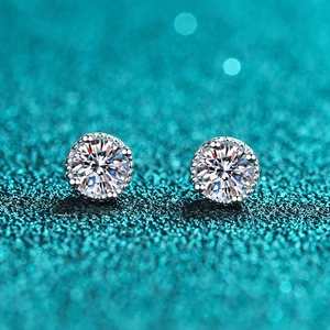 S925 sterling silver four-prong stud earrings with round moissanite on sparkling background