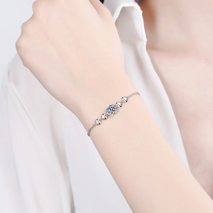 S925 Sterling Silver Moissanite Bracelet featuring a central gem and heart motifs