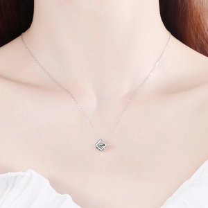 Minimalist S925 silver necklace with square moissanite pendant worn by model