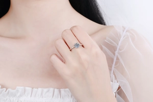 Detailed view of an S925 sterling silver ring with a classic six-prong moissanite setting