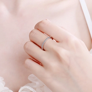 Elegant S925 sterling silver half eternity ring with Moissanite stones on a female hand