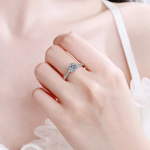 Classic six-prong S925 sterling silver ring with 1 carat moissanite on model hand