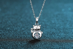 Macro view of S925 sterling silver Maneki-neko necklace with brilliant moissanite stone
