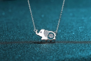 Macro detail of S925 sterling silver elephant pendant with sparkling moissanite stone