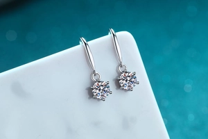 Macro detail of six-prong brilliant cut moissanite earrings in S925 sterling silver