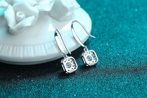 Macro shot of S925 sterling silver square drop earrings with round moissanite center