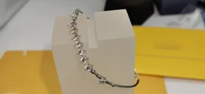 Detail of 925 sterling silver bracelet featuring eleven brilliant-cut moissanite stones