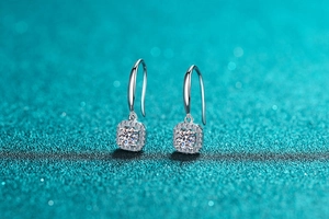 Macro view of S925 sterling silver halo drop earrings with moissanite center stone