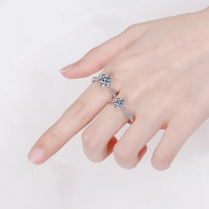 Elegant S925 sterling silver moissanite ring with four-prong setting and side accents