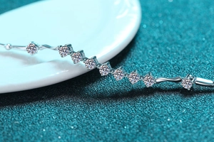 Macro shot of 925 sterling silver bracelet with moissanite stones and claw setting detail