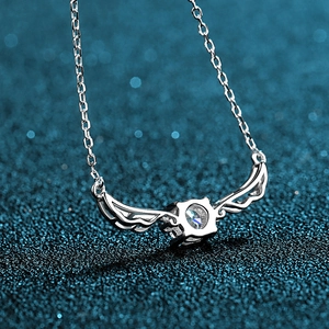 S925 sterling silver angel wing necklace with a 0.5ct moissanite on a blue background