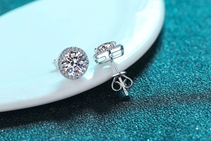 Macro shot of 925 sterling silver halo moissanite stud earrings with push-back closures