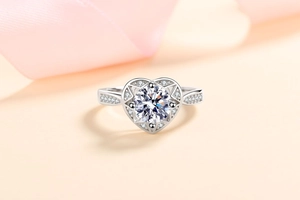 Macro view of S925 silver ring featuring a round moissanite inside a hollow heart frame