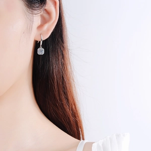 Elegant S925 sterling silver square drop earrings with moissanite on a model