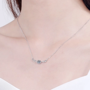 S925 sterling silver necklace with angel wing pendant and 0.5ct moissanite on model