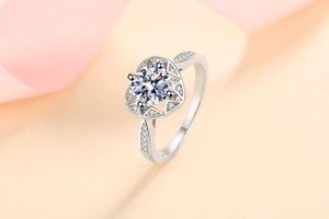 Detail view of heart-shaped hollow ring setting with brilliant round moissanite stone
