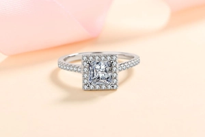 Macro shot of 925 sterling silver princess cut moissanite ring with halo setting details