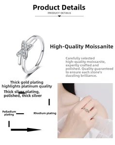Detail of S925 sterling silver criss-cross ring with moissanite stones and plated finish