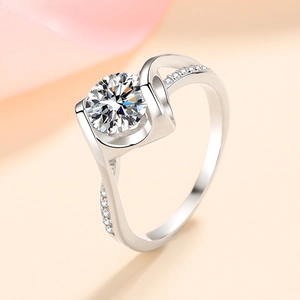 Elegant 925 sterling silver ring with round moissanite in a twisted pavé setting