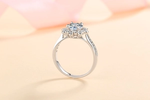 Detail shot of S925 silver ring featuring moissanite main stone and petal halo setting