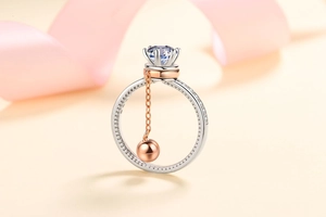 Detail view of a dual-tone S925 silver ring featuring a rotatable rose gold bead and cz stone