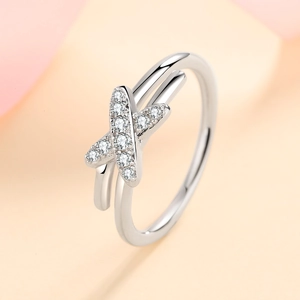 Polished S925 sterling silver crisscross ring with pavé moissanite stones in a minimalist style