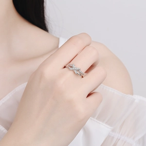 Elegant S925 sterling silver moissanite cross ring shown on a hand with white top