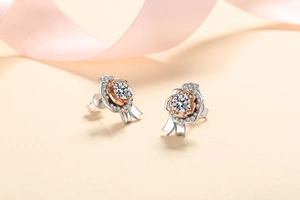 Macro shot of S925 silver rose earrings with sparkling moissanite and rose gold detail